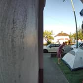 Video grab of the moment a mum was baffled when she looked outside and found a stranger had pitched a tent in her front garden overnight