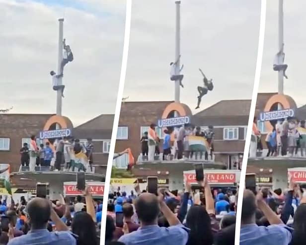 This is the heart-stopping moment an Indian fan plunged 30ft after trying to tie a flag around a pole during wild T20 World Cup celebrations. 
