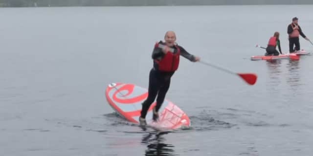 Lib Dem leader Sir Ed Davey falls into lake.