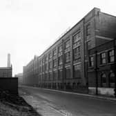 Looking north-east along Springwell Street from the junction with Holbeck Lane in February 1945. Maenson House Clothing Works, owned by Joseph May and Sons Leeds Ltd., occupies most of the length of the right-hand side. The premises are also occupied by Tom Dixon, corn dealer.