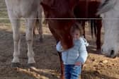 Sixteen-month-old has a heart-warming interaction with horses.