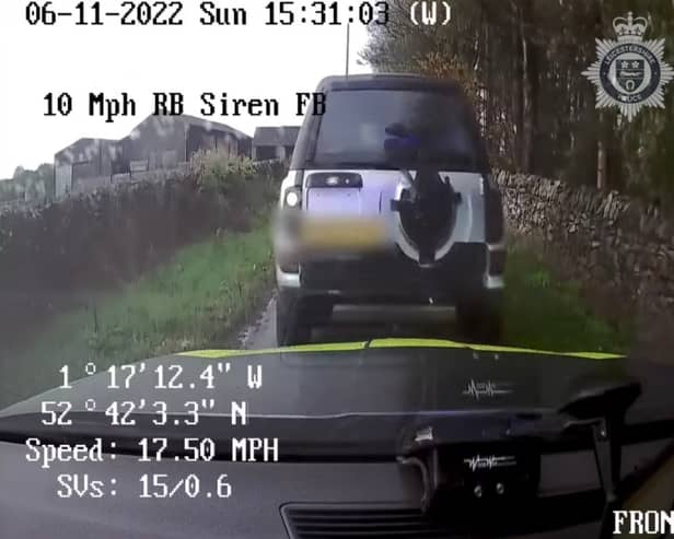 Land Rover driver reverse rams police car.