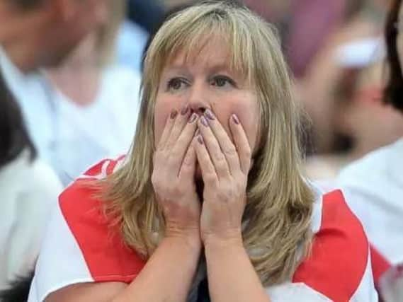 England fan watches on in Millennium Square