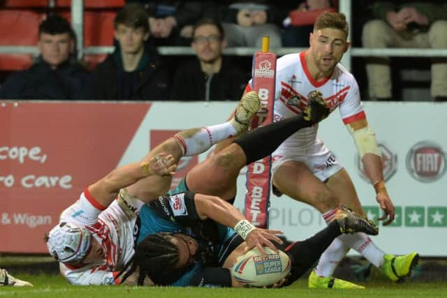 Konrad Hurrell scores the Rhinos' second try at St Helens.