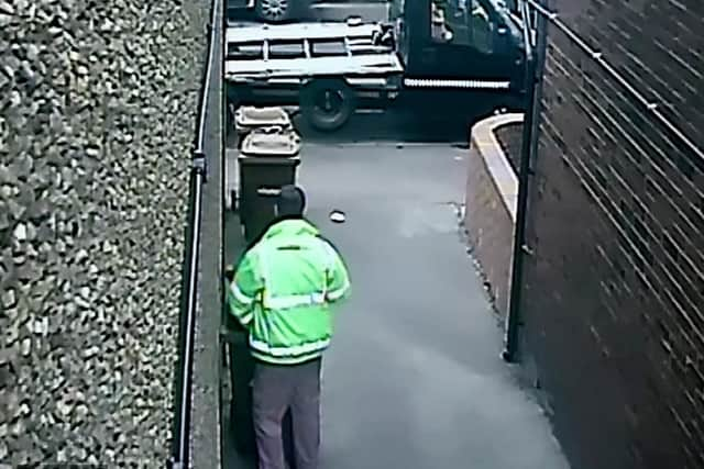 The binmen were caught on camera weeing in the street