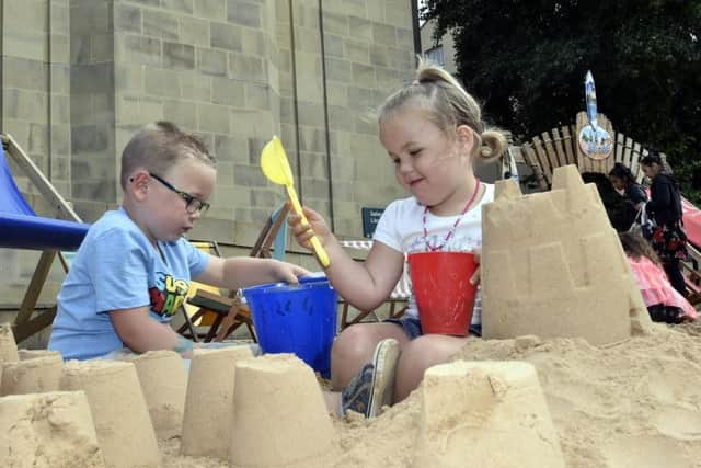 Archie Batty, four, and sister Elsie, three, of Crofton play at last year's City Beach