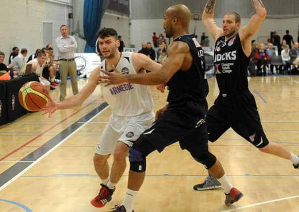 Jack Stannard of Carnegie up against Glasgow's player/head coach Sterling Davis