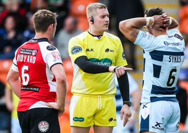 Referee Chris Leatherbarrow with Leigh Centurions and  Featherstone Rovers captains Martyn Ridyard and Paul Sykes.