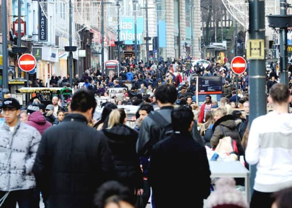 Shoppers in Briggate, Leeds.