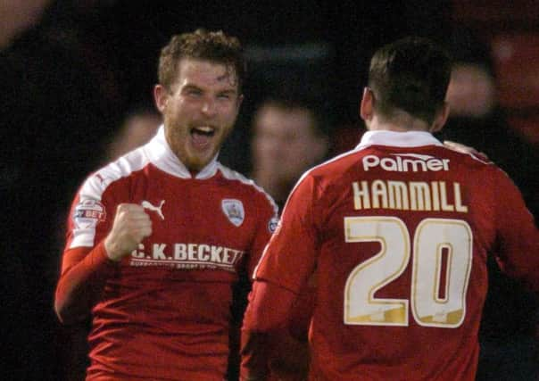 Sam Winnall celebrates after scoring with teammate Adam Hammill. PIC: James Hardisty