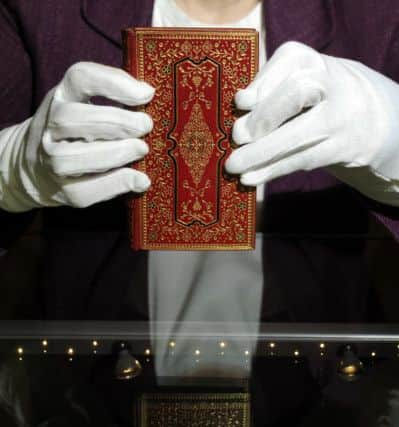 Pictured is Dr Stella Butler with one of the exhibits, Thomas Delaune's The Present State of London or, Memorials comprehending a full and succinct account of the ancient and modern state thereof, London, 1683.  Picture Bruce Rollinson