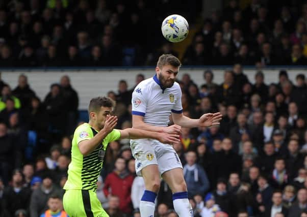 Stuart Dallas scores the first goal against Huddersfield Town.