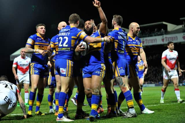 Jamie Jones-Buchanan celebrates scoring the Rhinos opening try against St Helens.