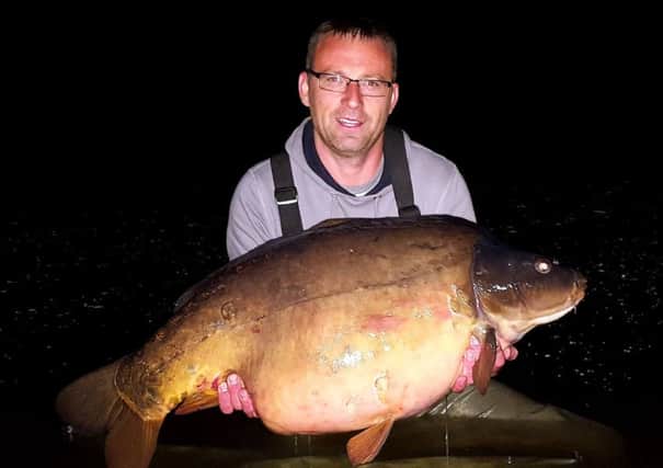Steve Catterall with the first ever authenticated fifty pound carp from a British river.