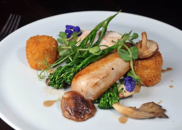 Chicken supreme and saute wild mushroom, sprouting broccoli, chicken legg bon bon and a tarragon cream sauce. PIC: Tony Johnson