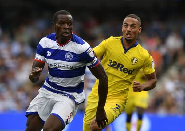 Kemar Roofe challenges QPR's Nedum Onuoha.