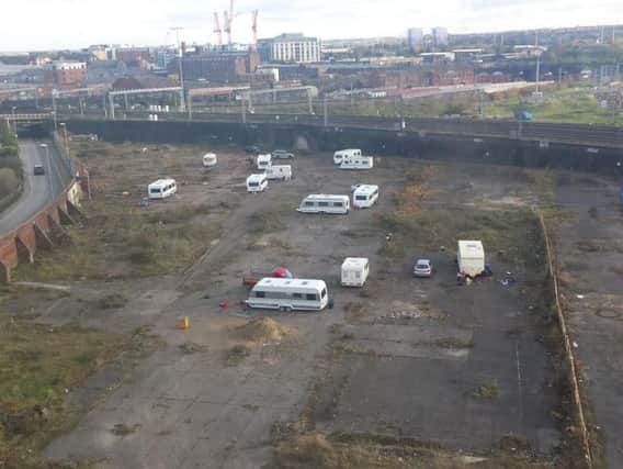 A group of travellers on the site off Globe Road today (Friday)