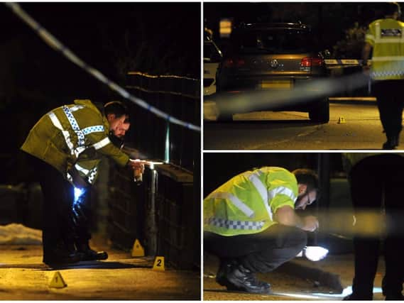 Police officers work at the scene