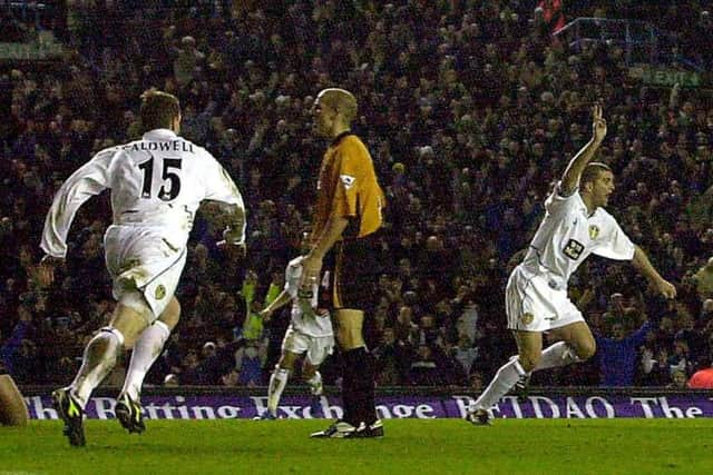 Dominic Matteo, centre, celebrates restoring United's lead over Wolves. PIC: James Hardisty