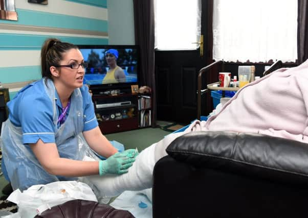 District nurse Rachel Bishop, who provides nursing care to people in their own home who are housebound and over 18. Visiting Vivienne in her Leeds home.
7th March 2018.