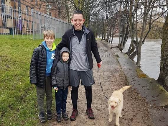 The hero dog walker and the two boys.