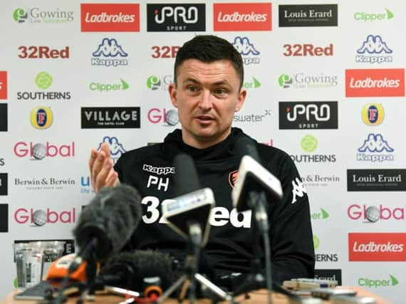 Paul Heckingbottom faces the media.